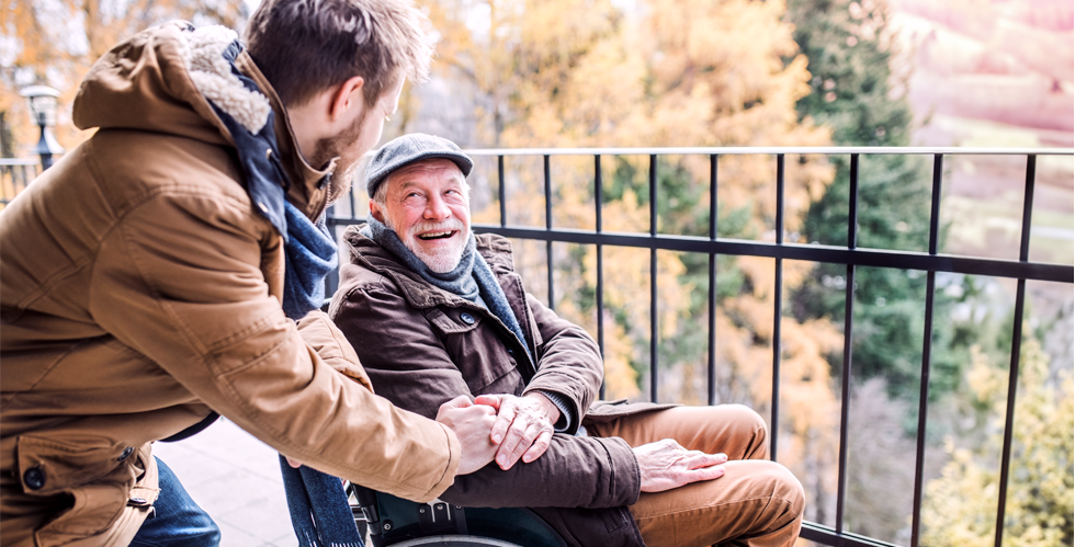 Young man and older man on a porch