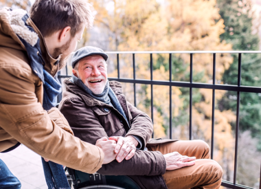 Young man and older man on a porch