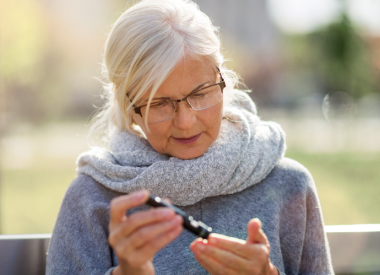 Woman taking her blood sugar measurement