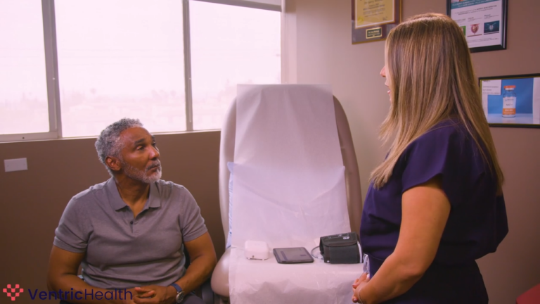 Healthcare professional with a patient, showing the portable Vivio System hardware ready for a non-invasive heart failure exam.